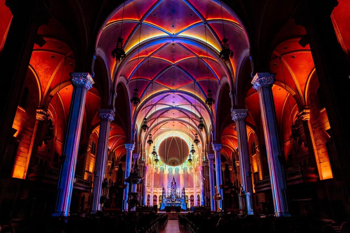 When Cathedrals Learn to Glow: Moment Factory and the Light That Touches You